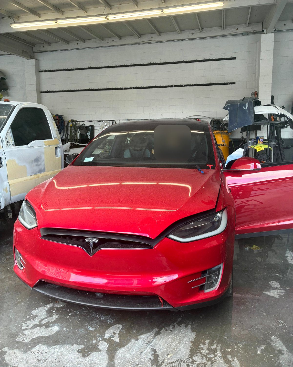 Windshield replacement on a red Tesla Model X by Auto Glass Elite Shield in Los Angeles