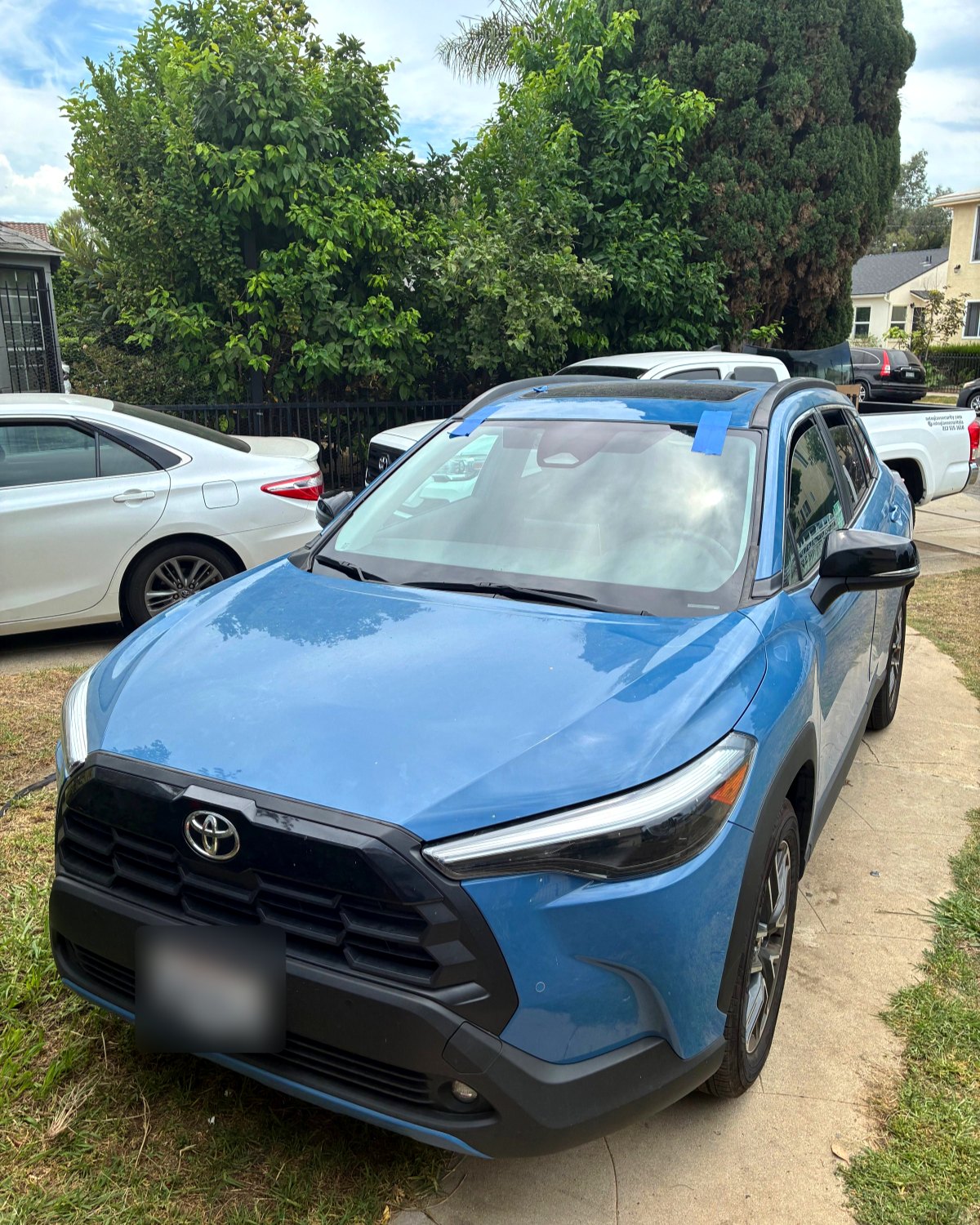 Windshield replacement on a Toyota Corolla Cross in a customer's driveway in Los Angeles