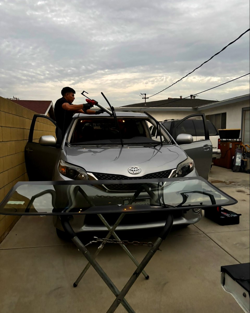 Elite Shield technician setting a new windshield during a mobile install in Los Angeles